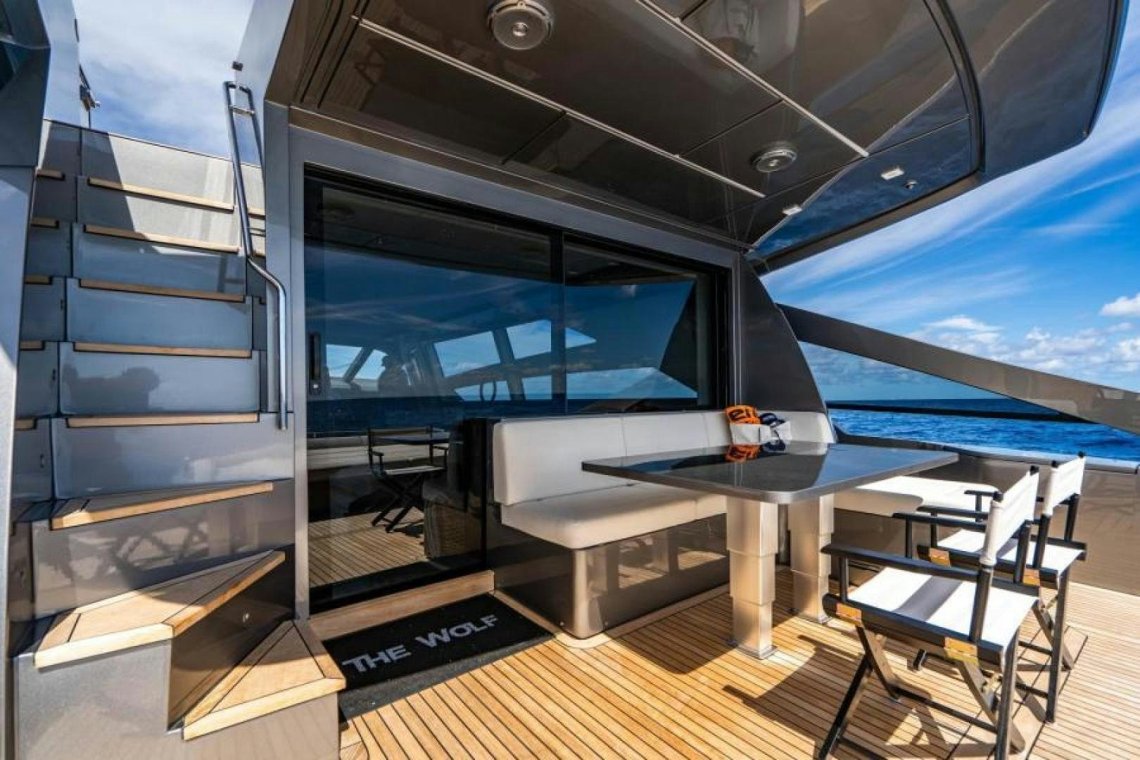 a room with a table and chairs aboard MARCHELLY Yacht for Sale