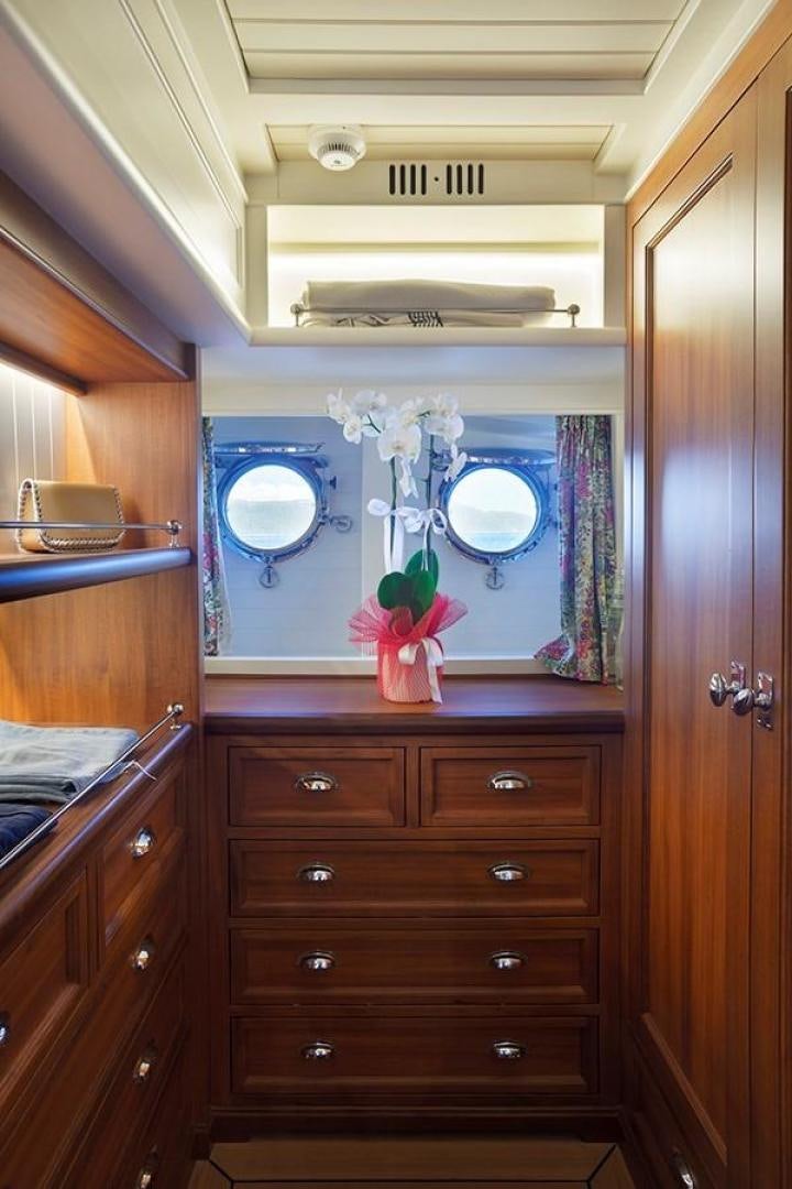 a room with a dresser and a mirror aboard DARWIN Yacht for Sale