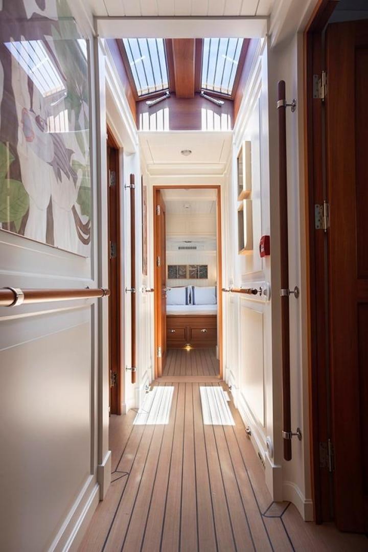 a hallway with doors aboard DARWIN Yacht for Sale