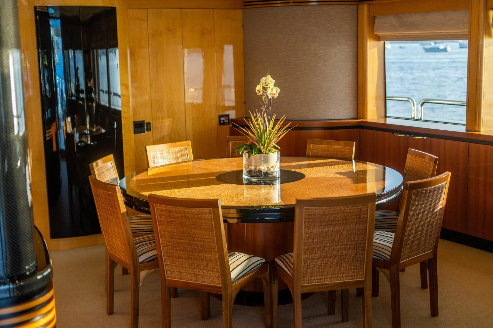 a dining table with chairs around it aboard MY SPIRIT Yacht for Sale