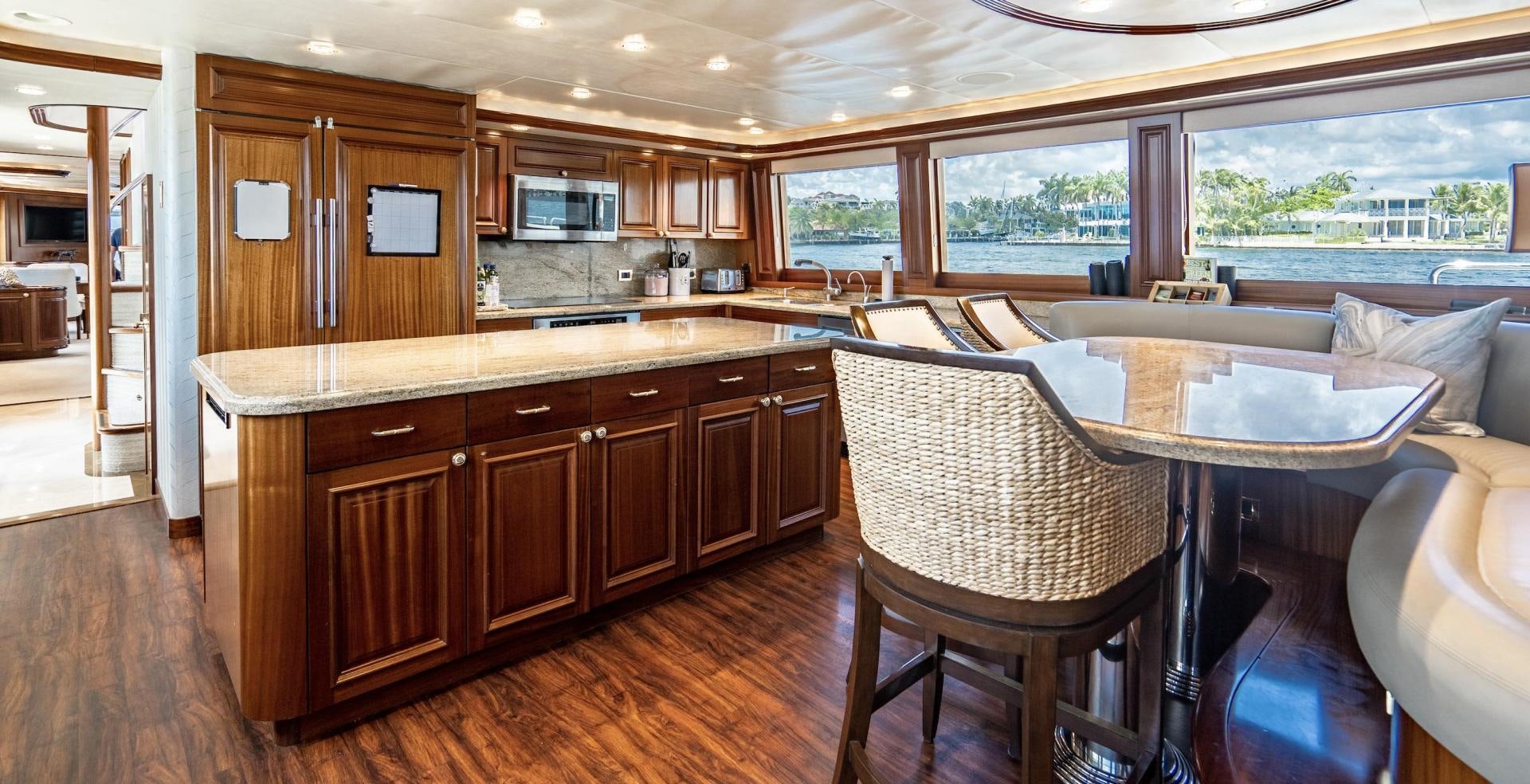 a kitchen with wooden cabinets aboard WILD KINGDOM Yacht for Sale