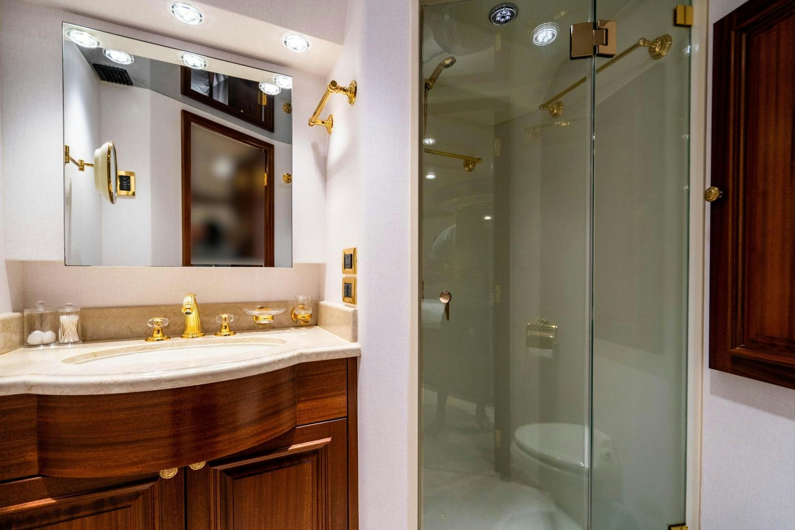 a bathroom with a large mirror aboard WILD KINGDOM Yacht for Sale