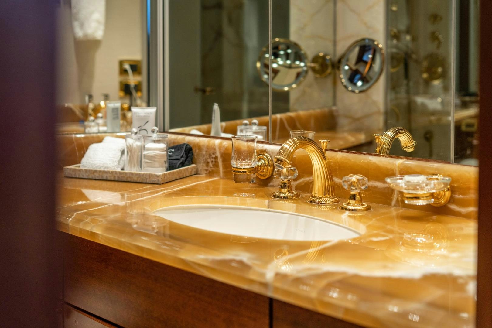 a bathroom sink with a mirror aboard WILD KINGDOM Yacht for Sale
