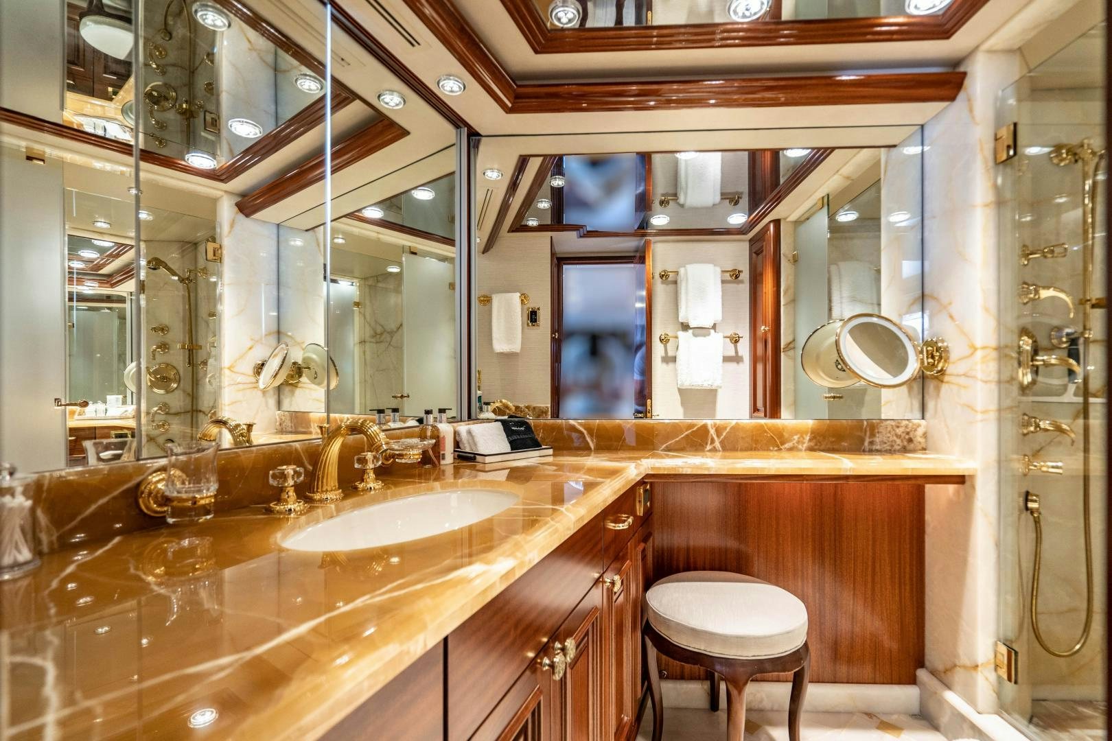 a bathroom with a large mirror aboard WILD KINGDOM Yacht for Sale