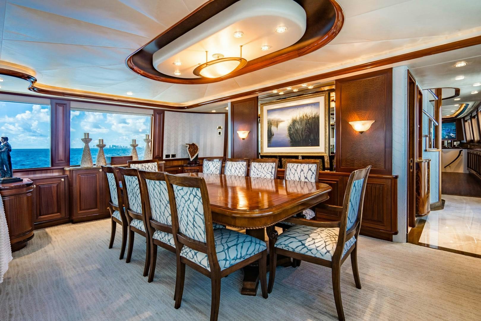 a dining room with a table and chairs aboard WILD KINGDOM Yacht for Sale