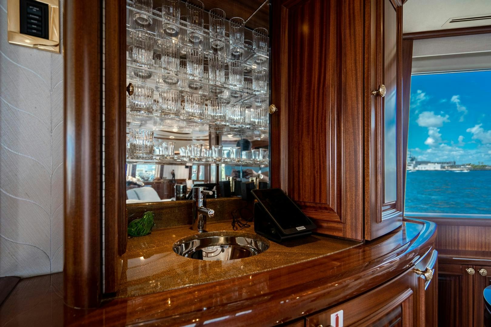 a kitchen with a sink and a large window aboard WILD KINGDOM Yacht for Sale