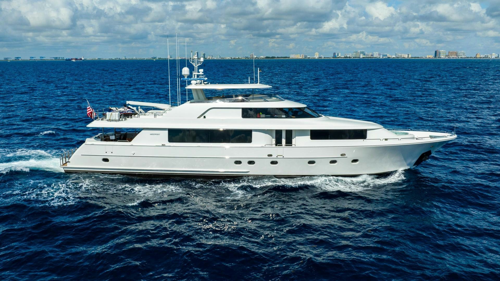 a white yacht in the water aboard WILD KINGDOM Yacht for Sale