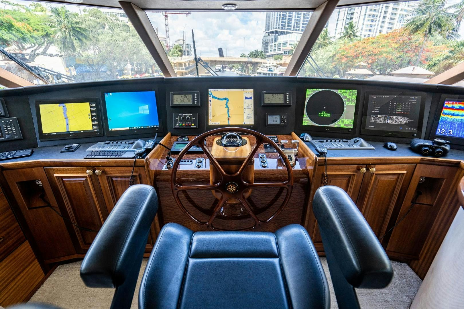 a control room with multiple monitors aboard WILD KINGDOM Yacht for Sale