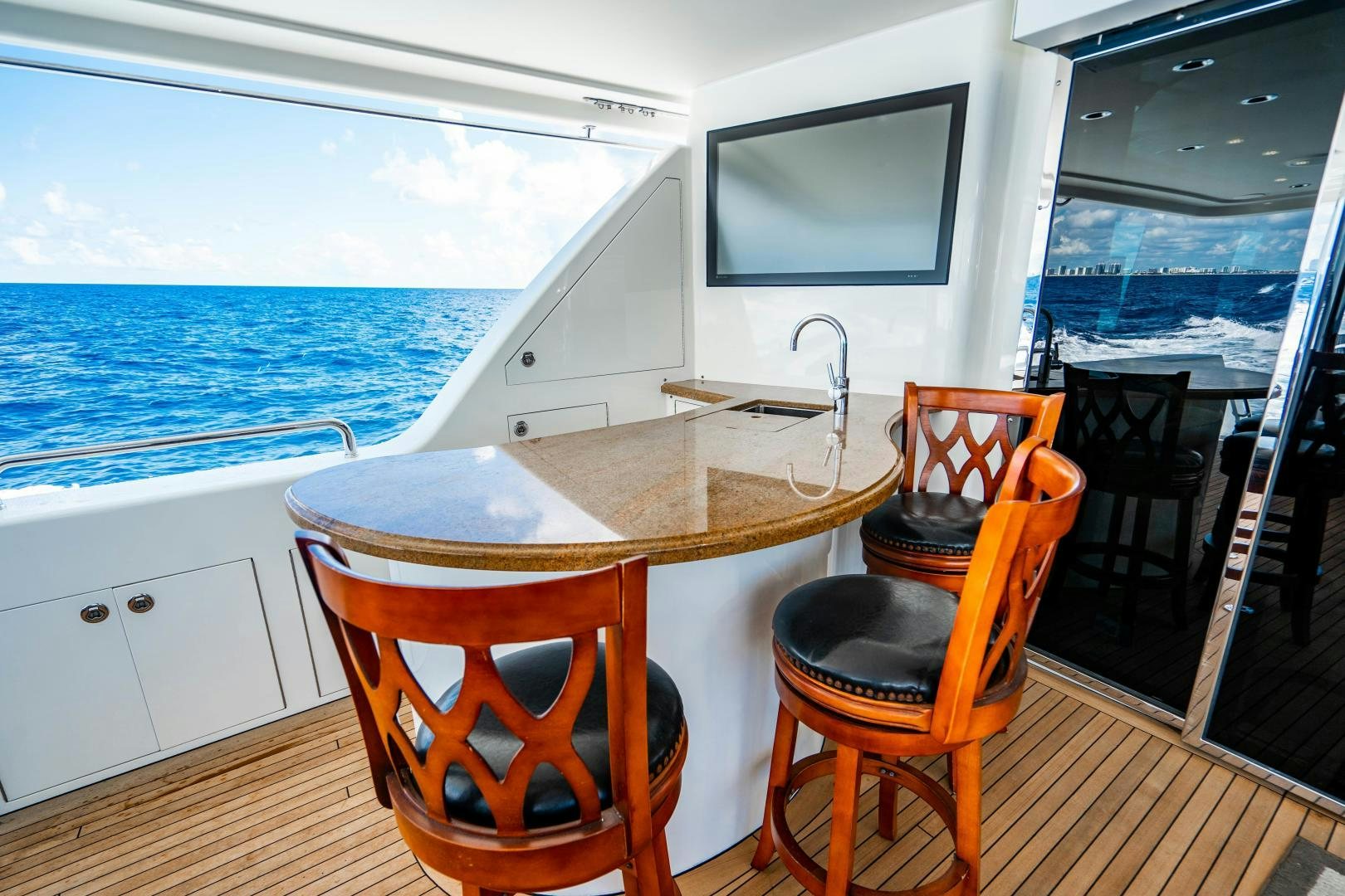 a table and chairs on a boat aboard WILD KINGDOM Yacht for Sale