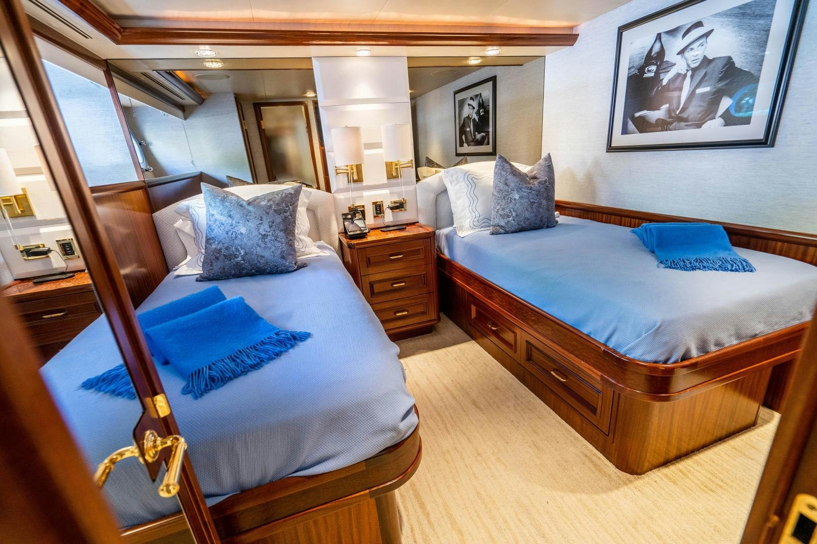 a bedroom with two beds aboard WILD KINGDOM Yacht for Sale