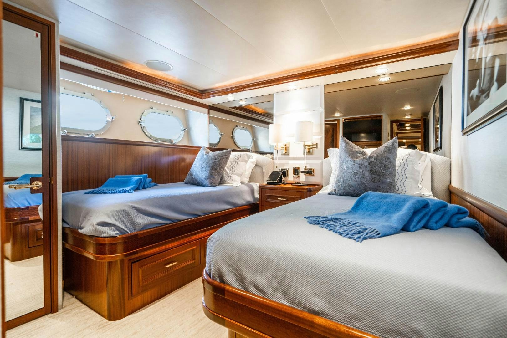 a couple of beds in a hotel room aboard WILD KINGDOM Yacht for Sale