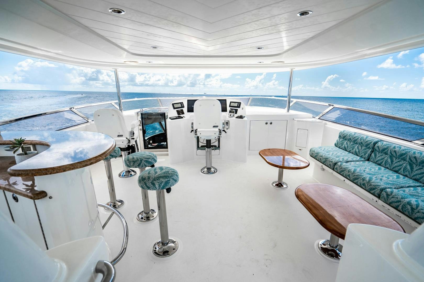 a room with a view of the ocean and the deck aboard WILD KINGDOM Yacht for Sale