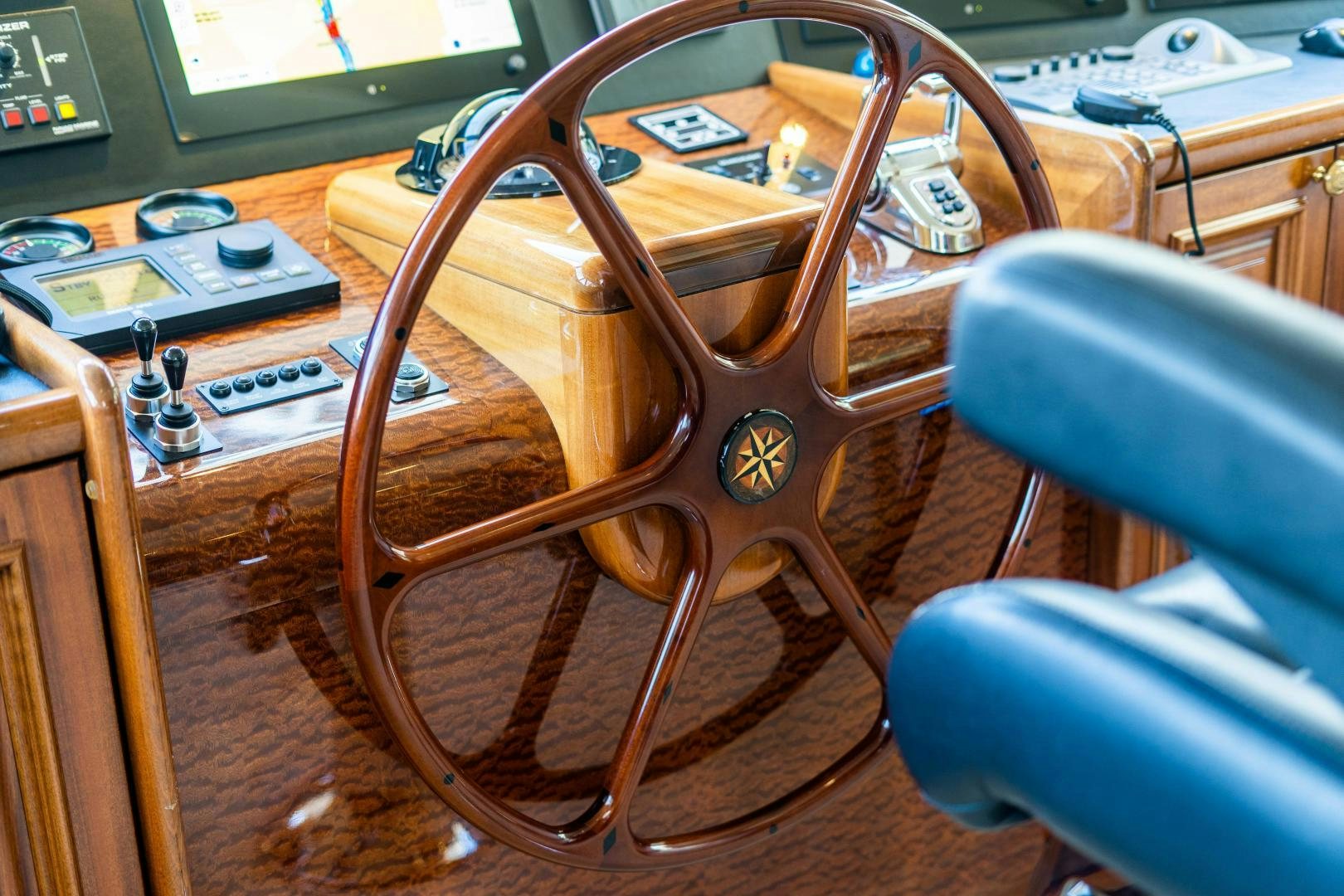 a wooden guitar on a wooden surface aboard WILD KINGDOM Yacht for Sale