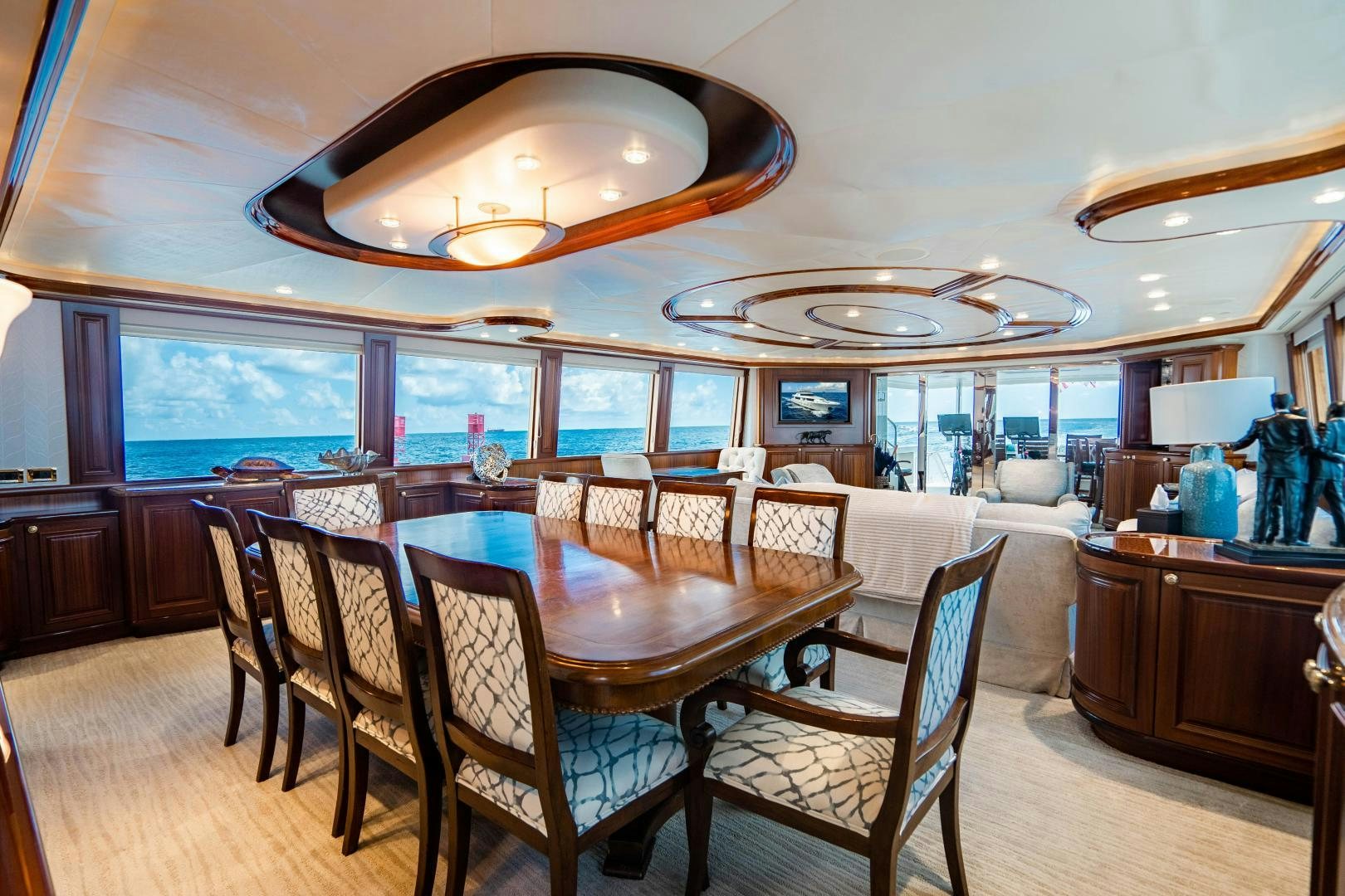 a dining room with a table and chairs aboard WILD KINGDOM Yacht for Sale