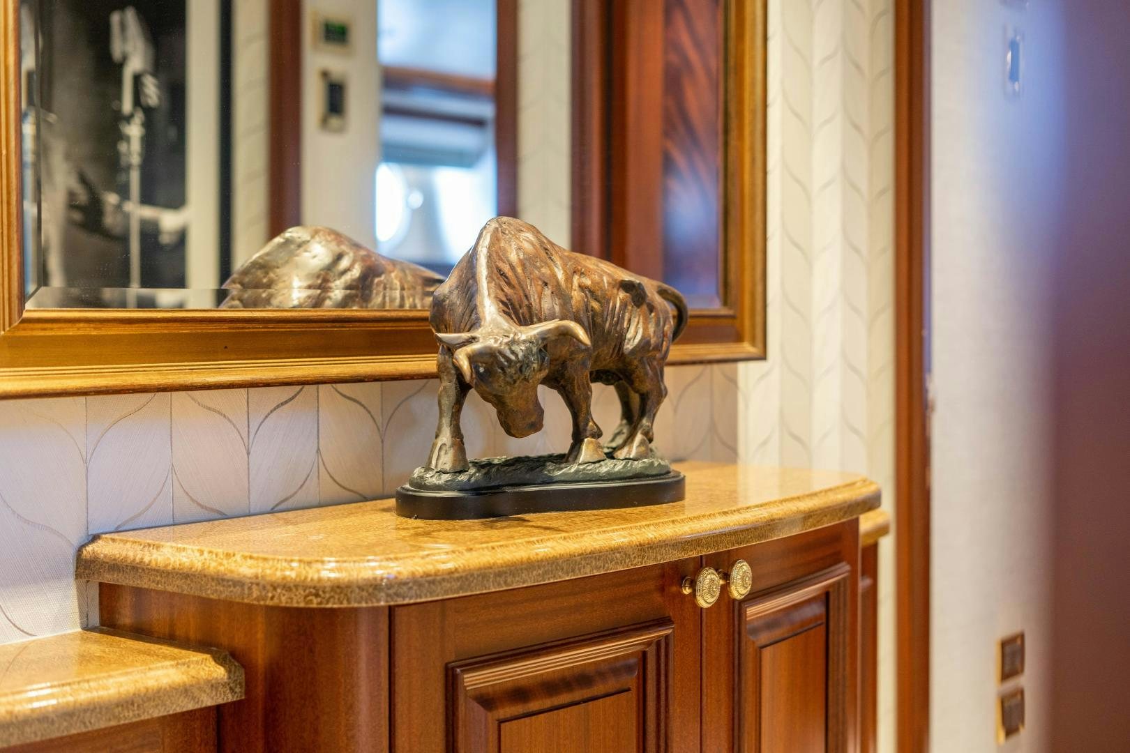 a statue of a lion on a table aboard WILD KINGDOM Yacht for Sale
