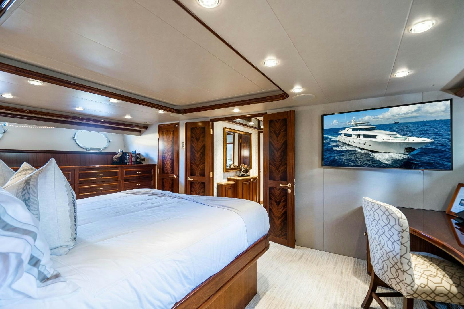 a bedroom with a large bed aboard WILD KINGDOM Yacht for Sale