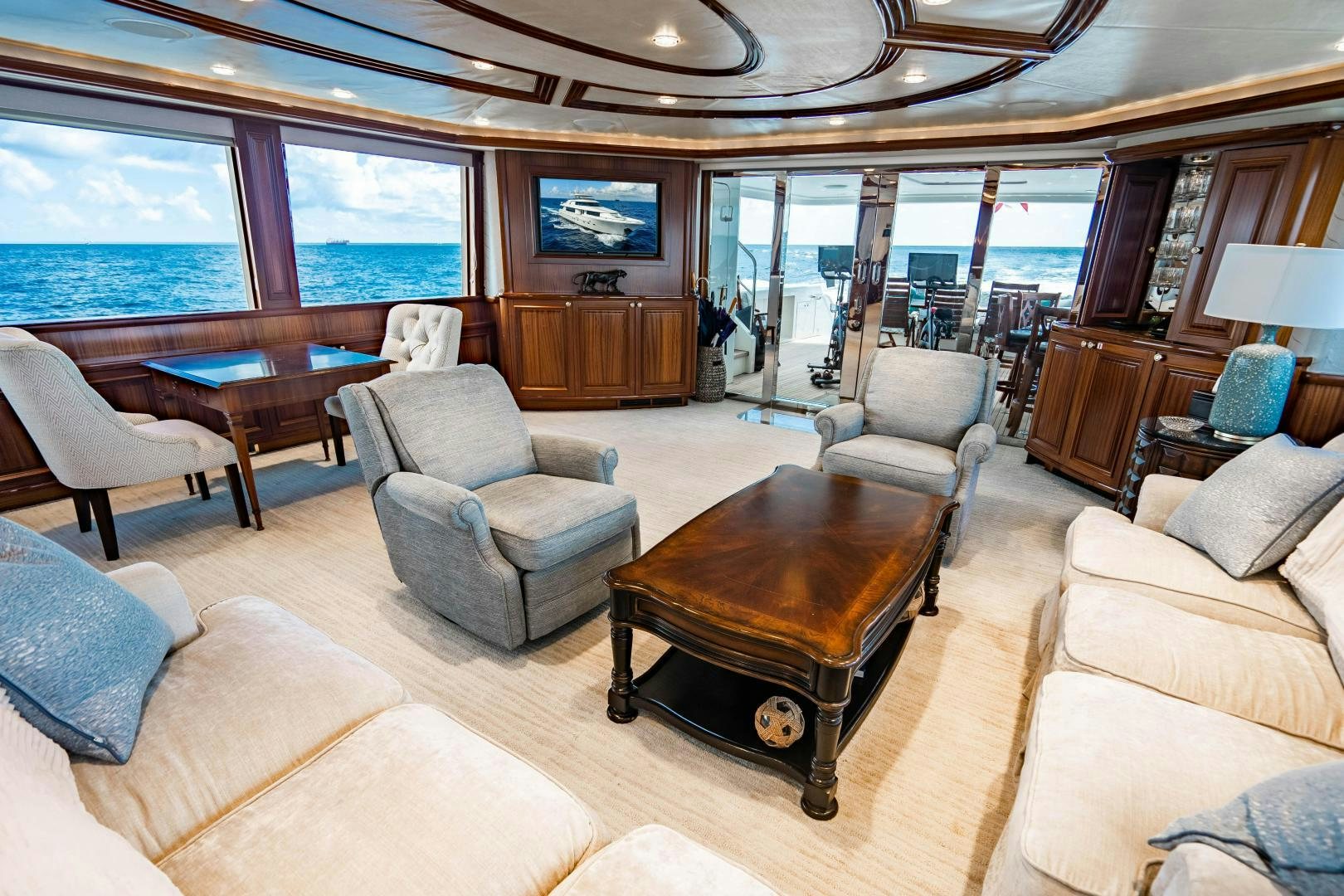 a living room with a large window aboard WILD KINGDOM Yacht for Sale