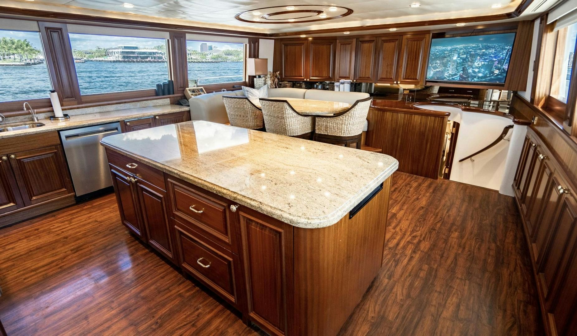 a kitchen with wooden cabinets aboard WILD KINGDOM Yacht for Sale