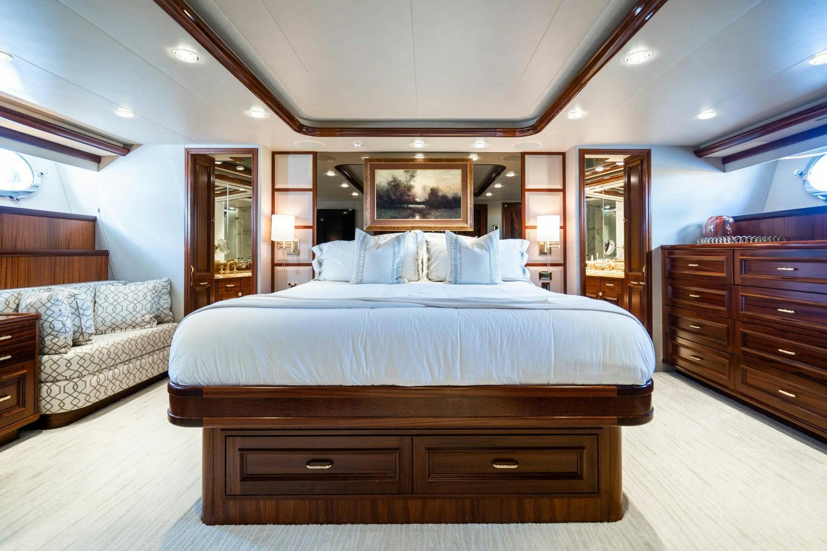 a large bed in a hotel room aboard WILD KINGDOM Yacht for Sale