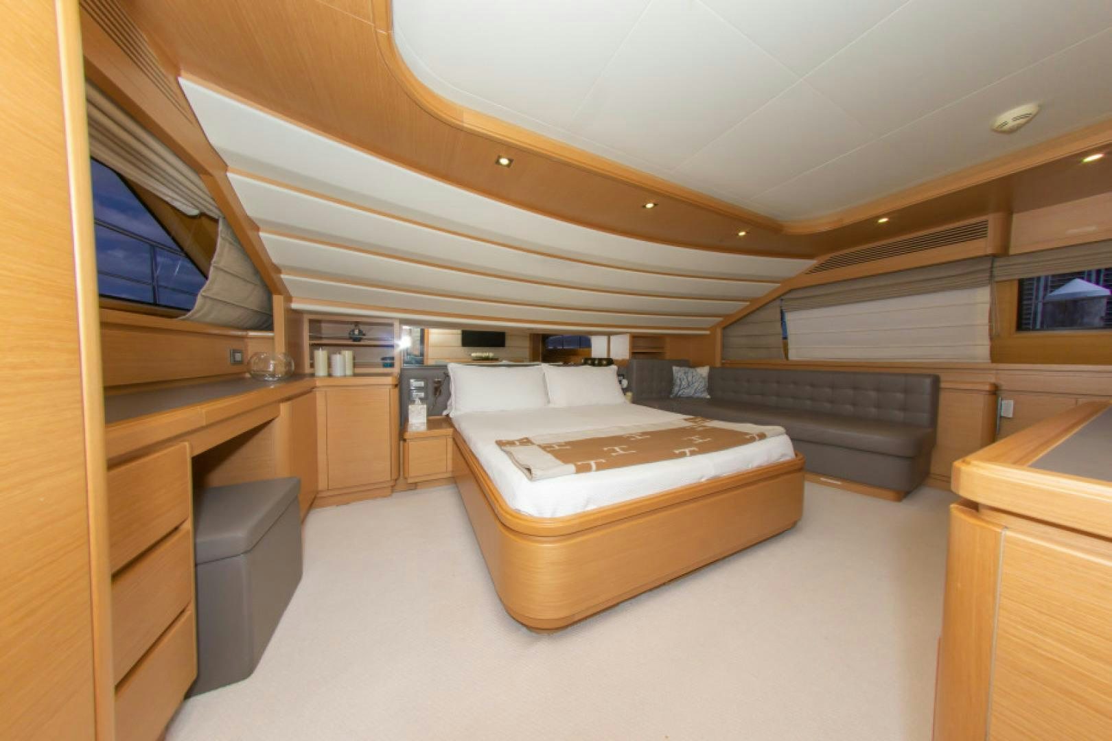 a room with a bed and a desk aboard ADAR Yacht for Sale
