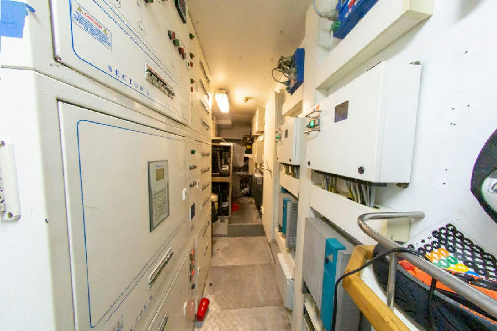 a hallway with white cabinets aboard ADAR Yacht for Sale