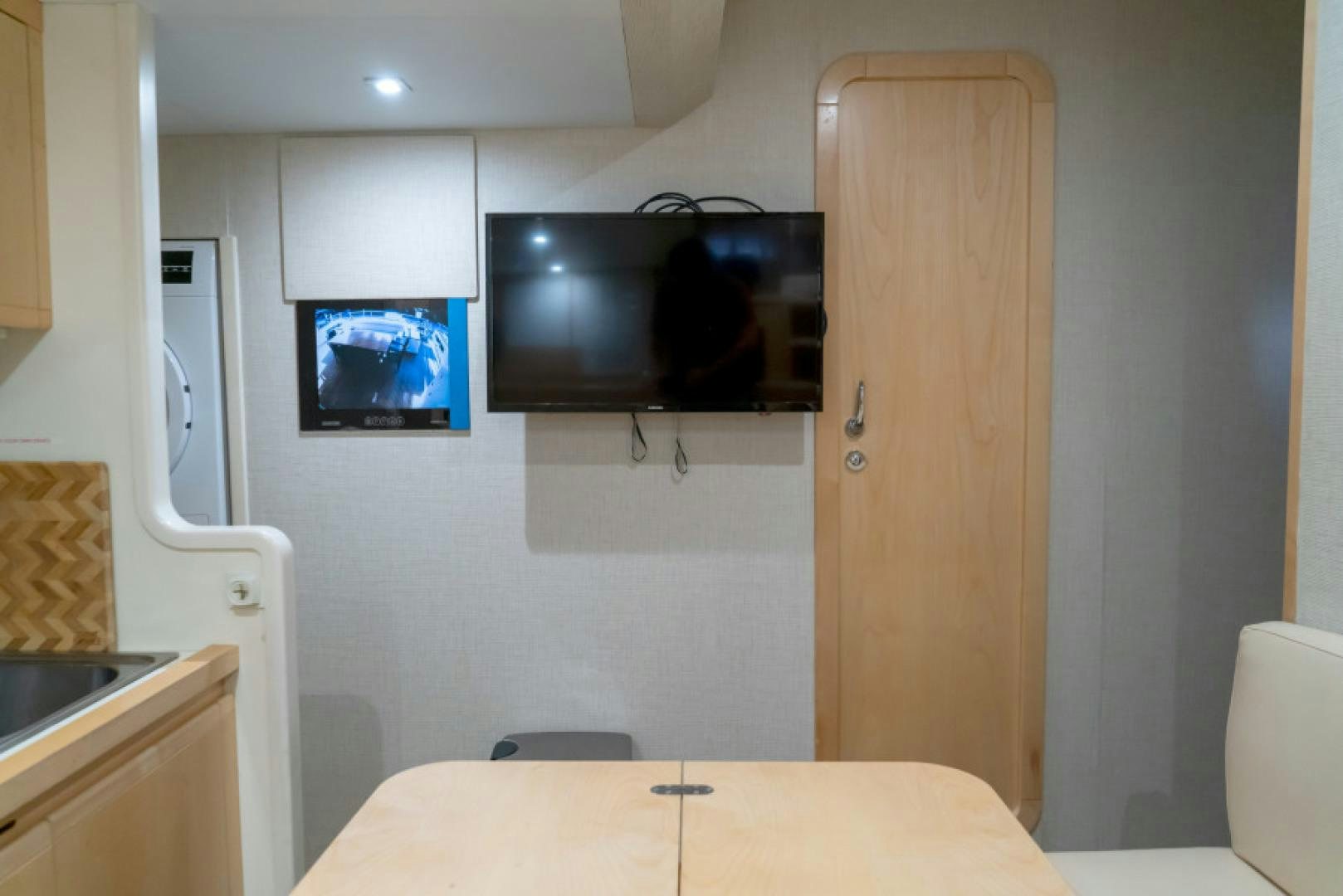 a tv on a wall aboard ADAR Yacht for Sale