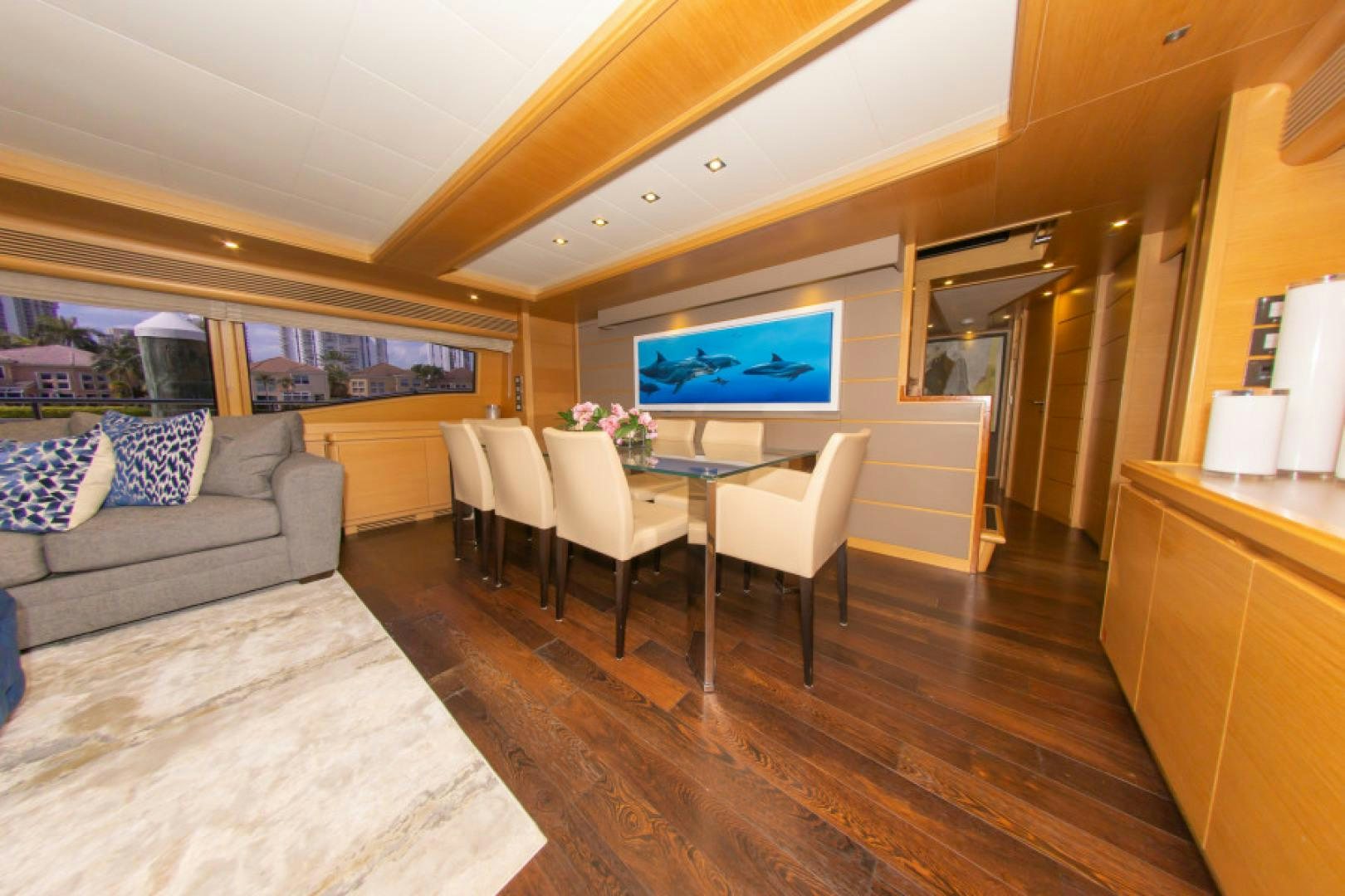 a living room with a couch and a tv aboard ADAR Yacht for Sale