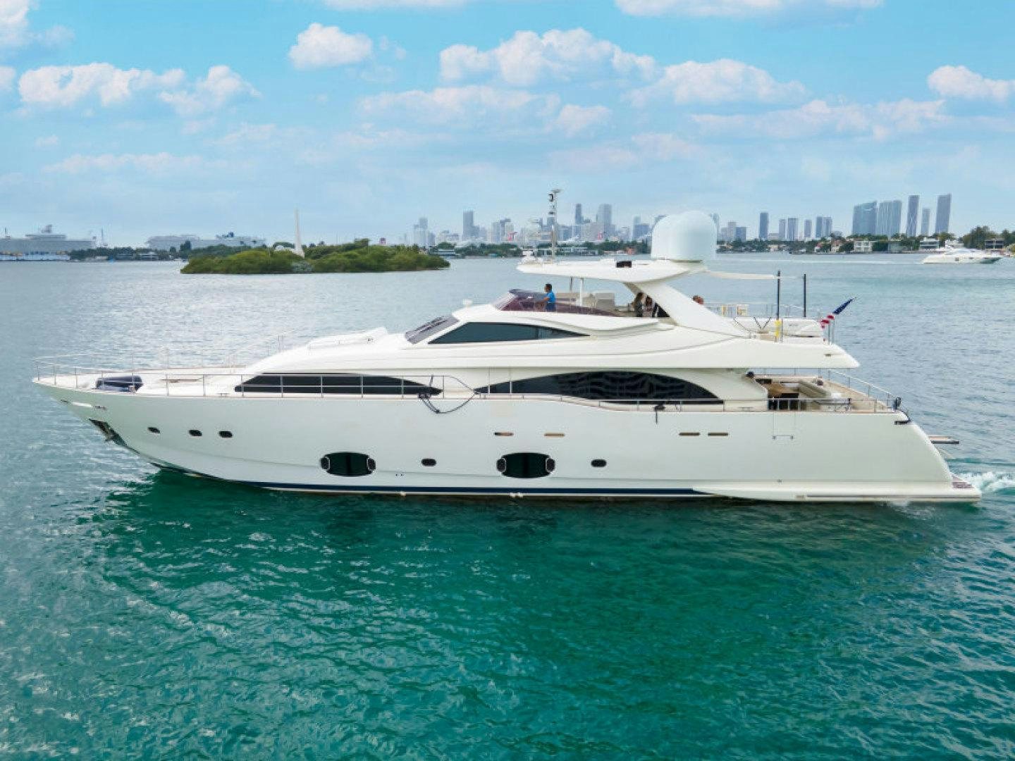 a white yacht in the water aboard ADAR Yacht for Sale