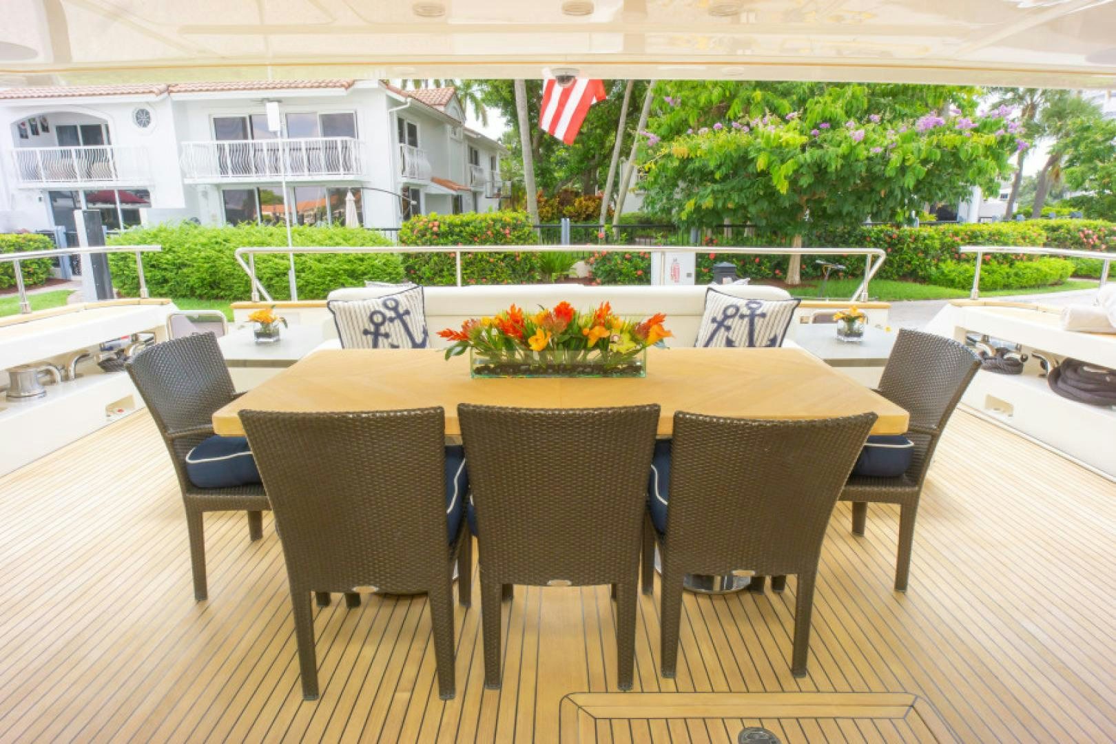 a table with chairs around it aboard ADAR Yacht for Sale