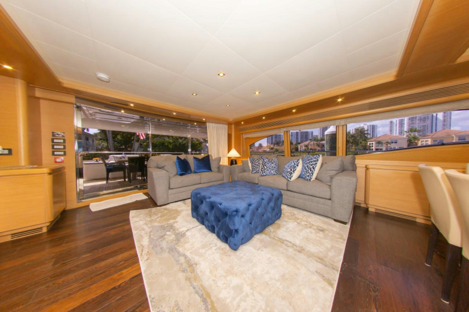 a living room with a large window aboard ADAR Yacht for Sale