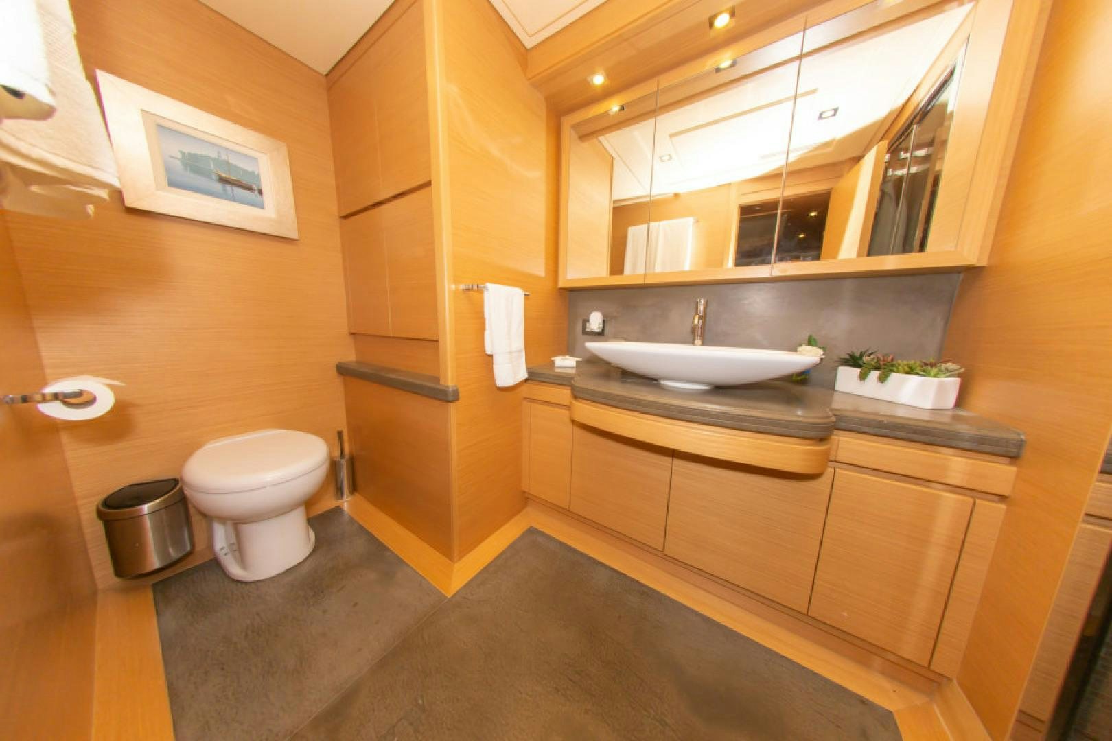 a bathroom with a sink toilet and a mirror aboard ADAR Yacht for Sale