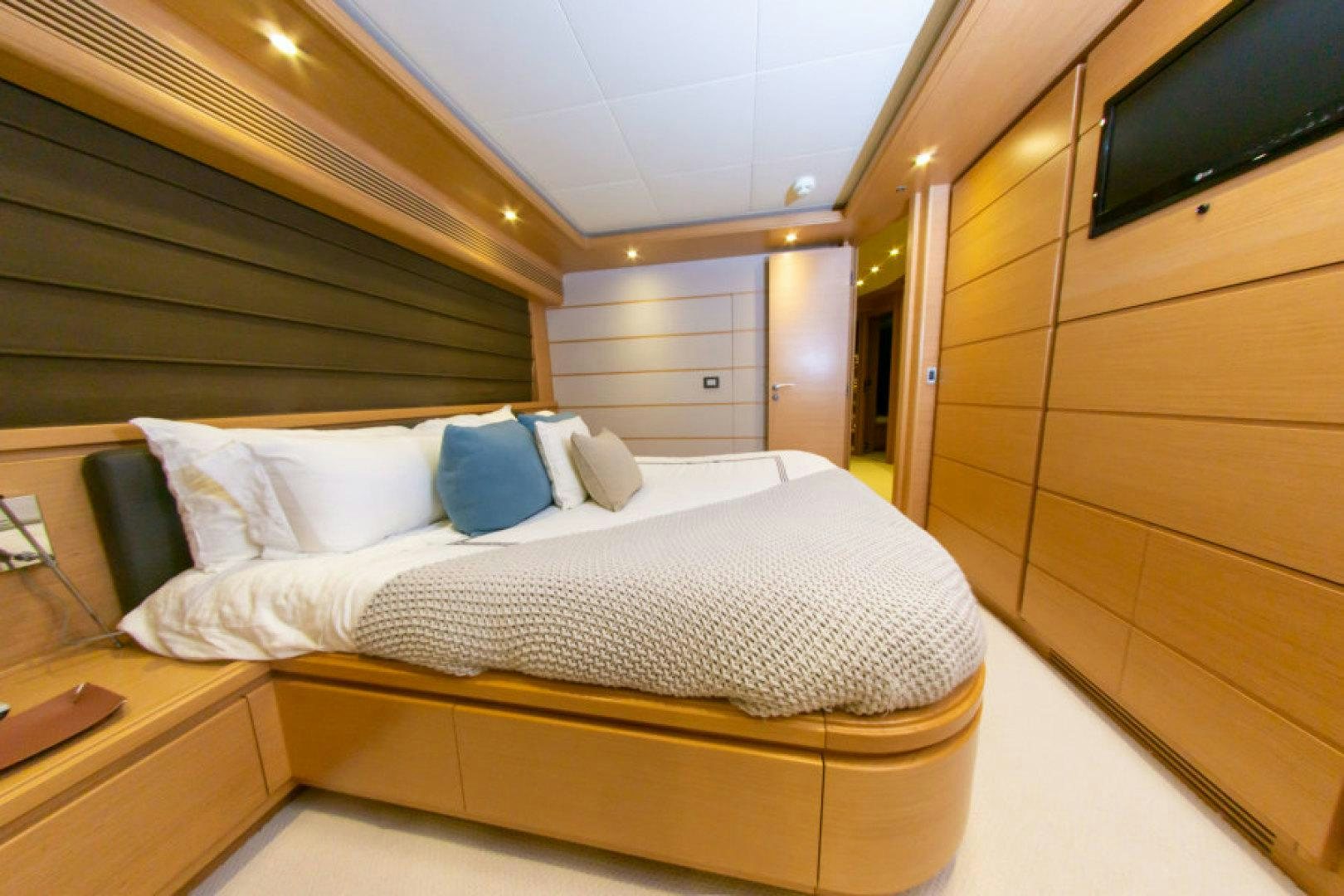 a bed in a room aboard ADAR Yacht for Sale