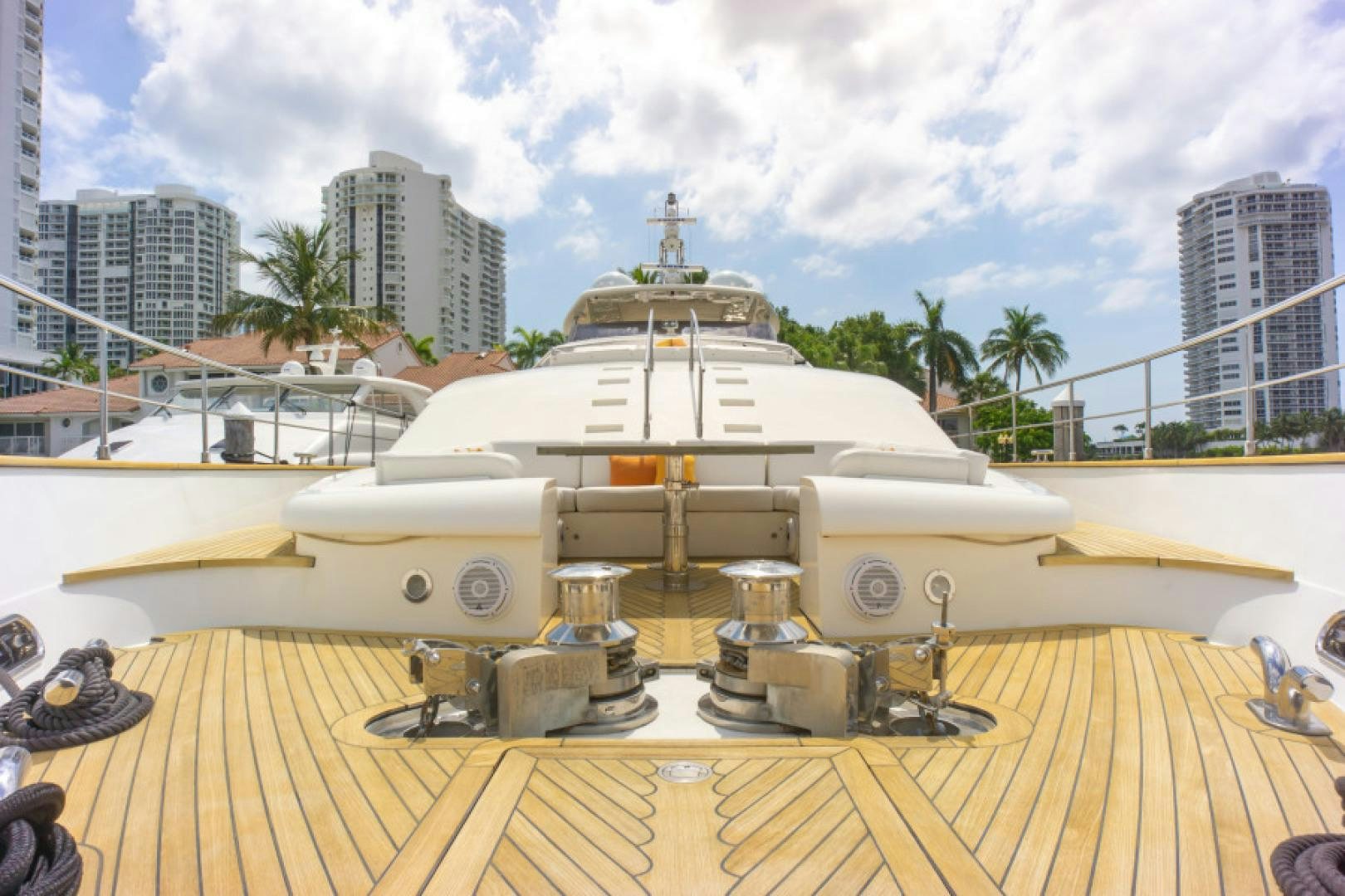 a large yellow boat in a large wooden dock aboard ADAR Yacht for Sale