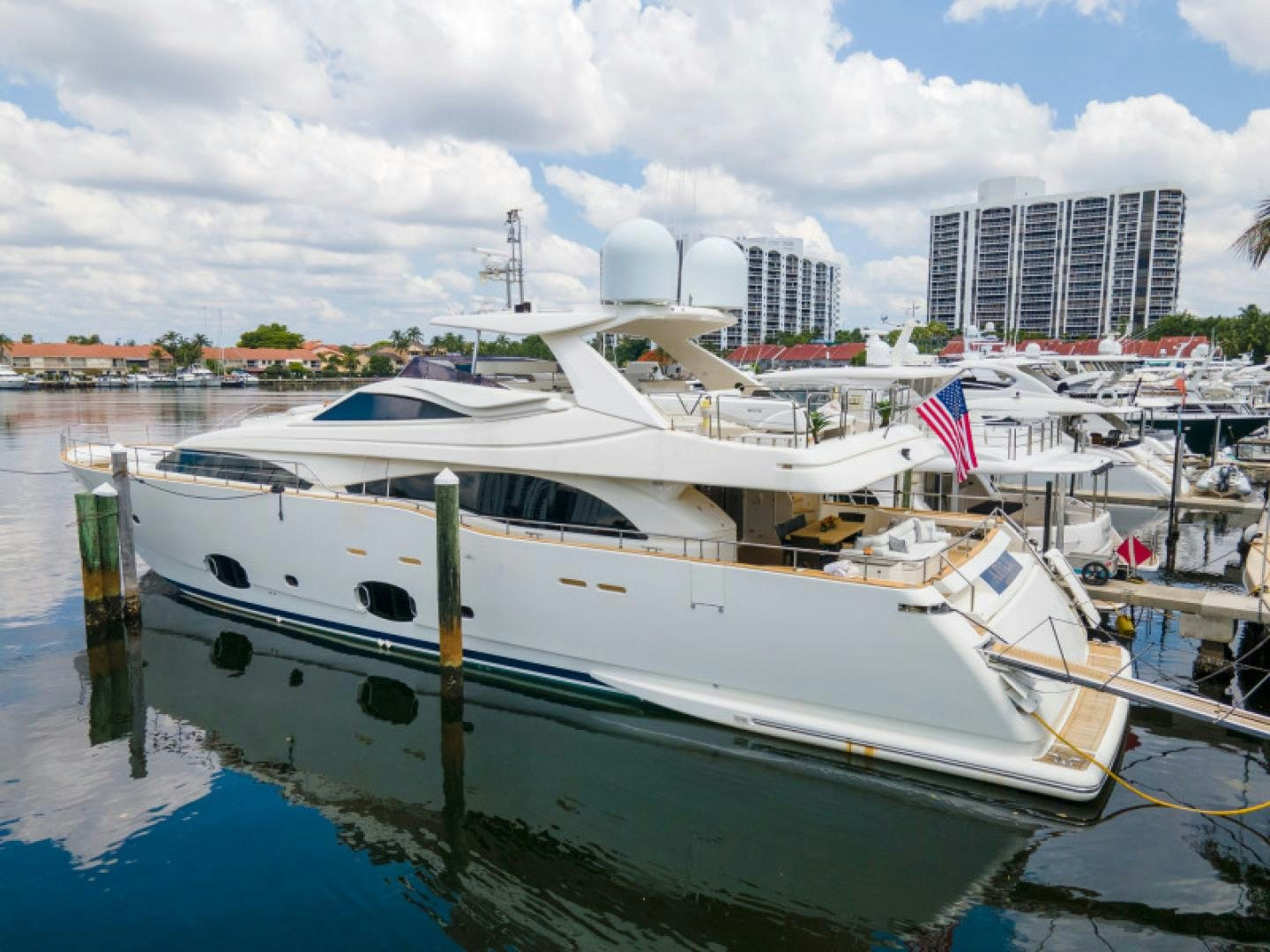 a boat docked at a pier aboard ADAR Yacht for Sale