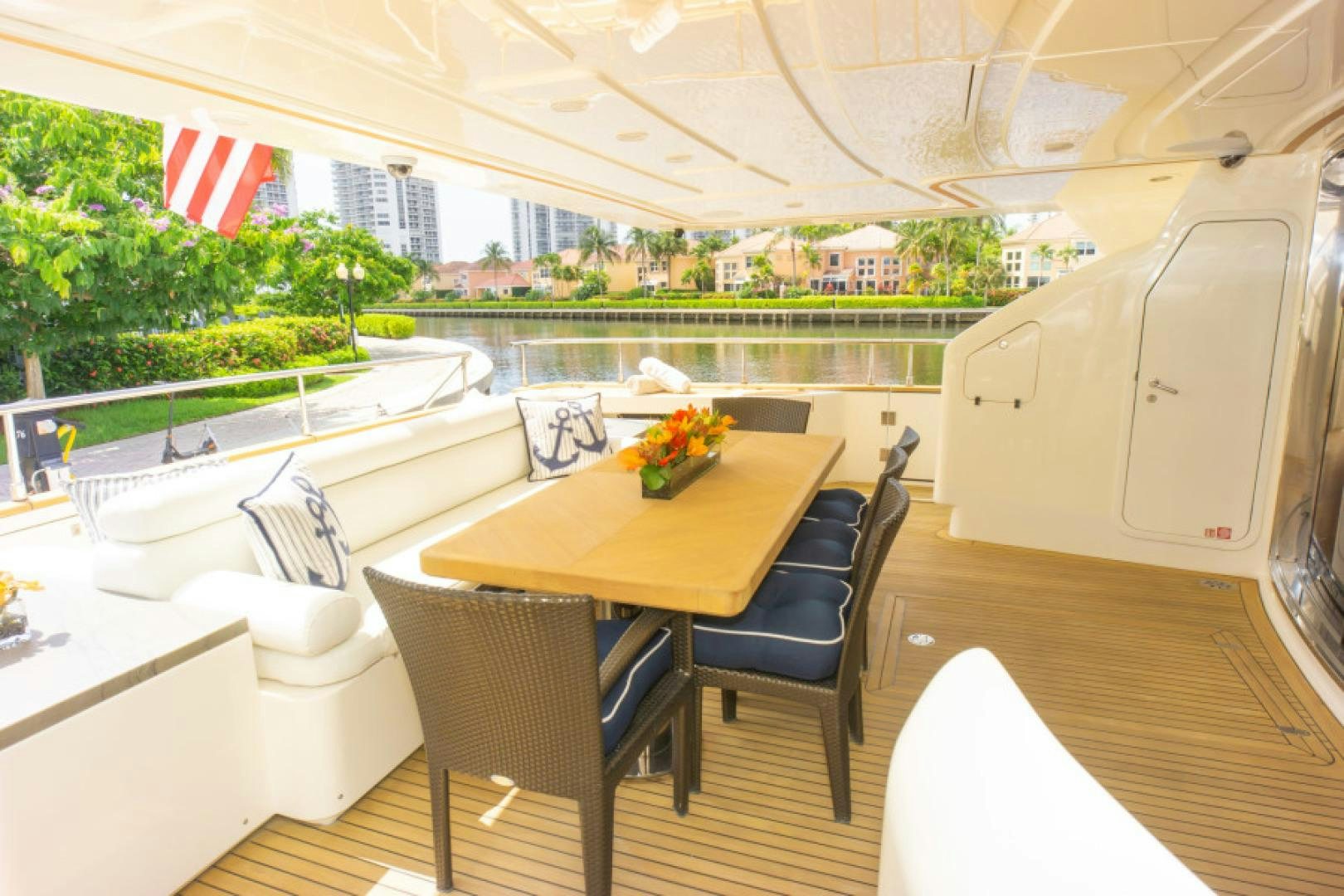 a table and chairs in a room aboard ADAR Yacht for Sale
