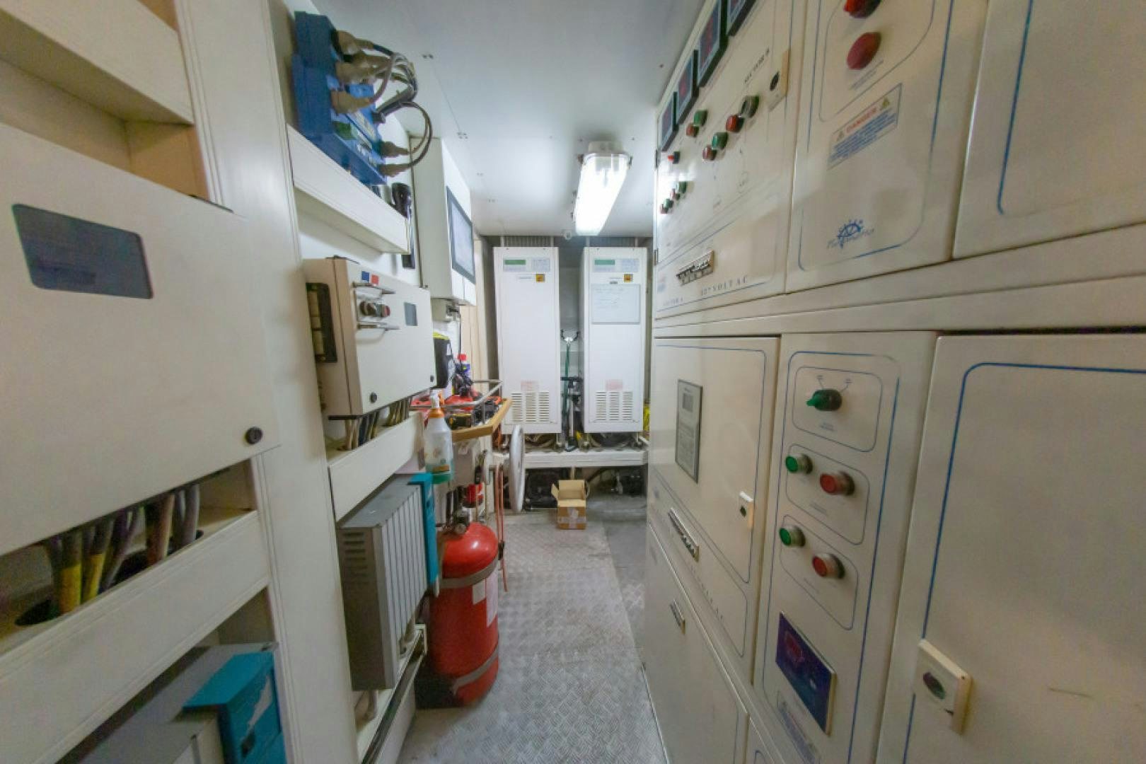 a room with white cabinets aboard ADAR Yacht for Sale