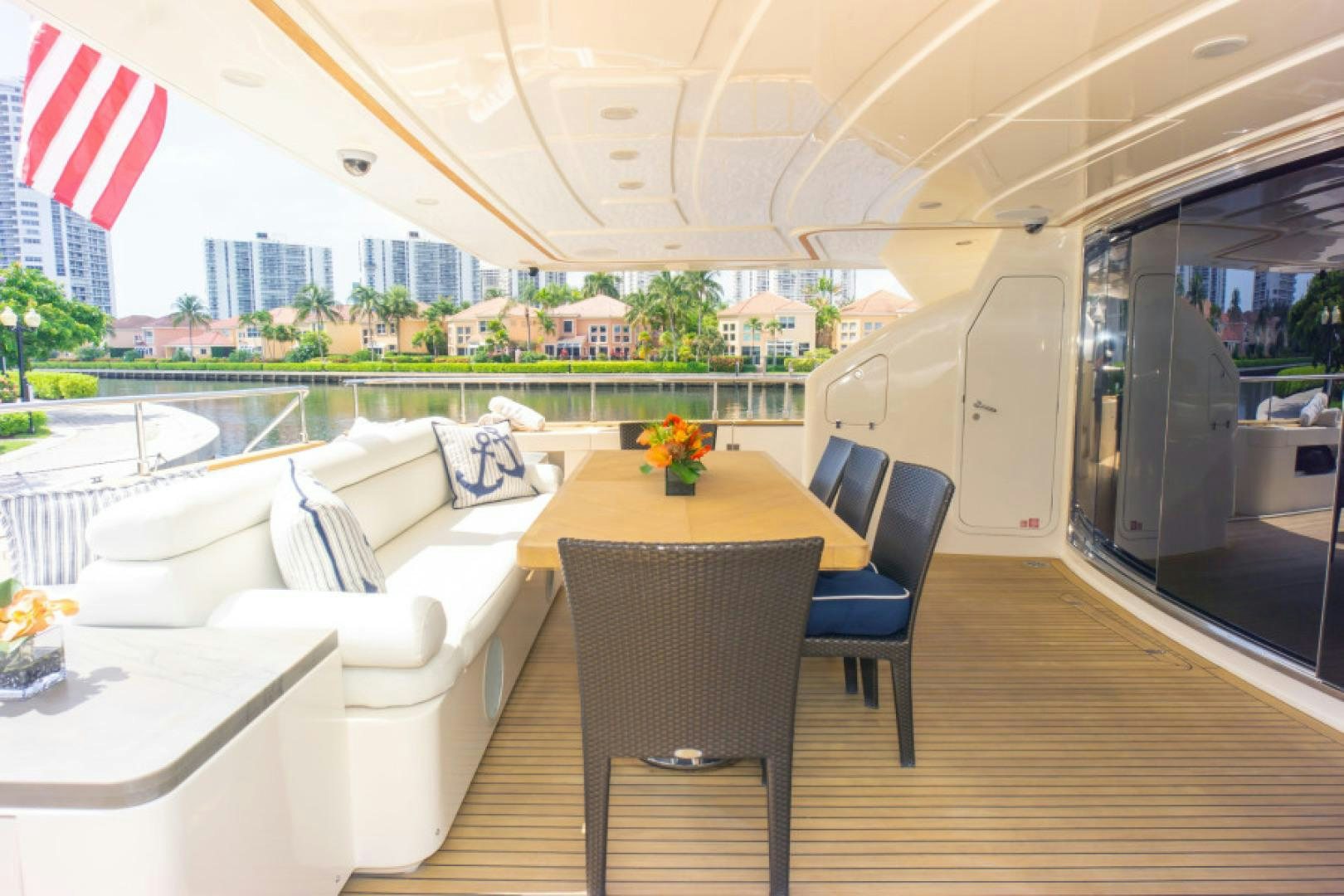 a room with a table and chairs aboard ADAR Yacht for Sale