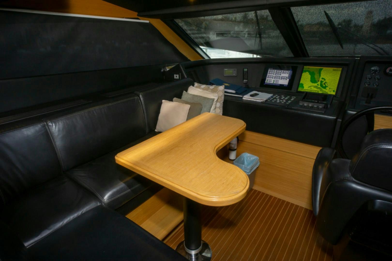 a room with a desk and chairs aboard ADAR Yacht for Sale