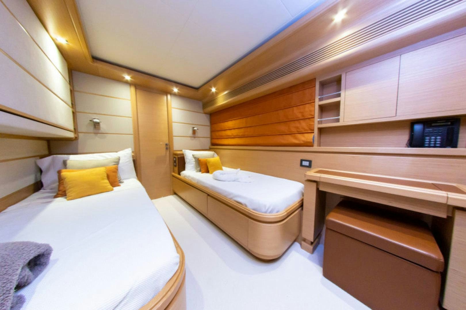 a room with two beds aboard ADAR Yacht for Sale