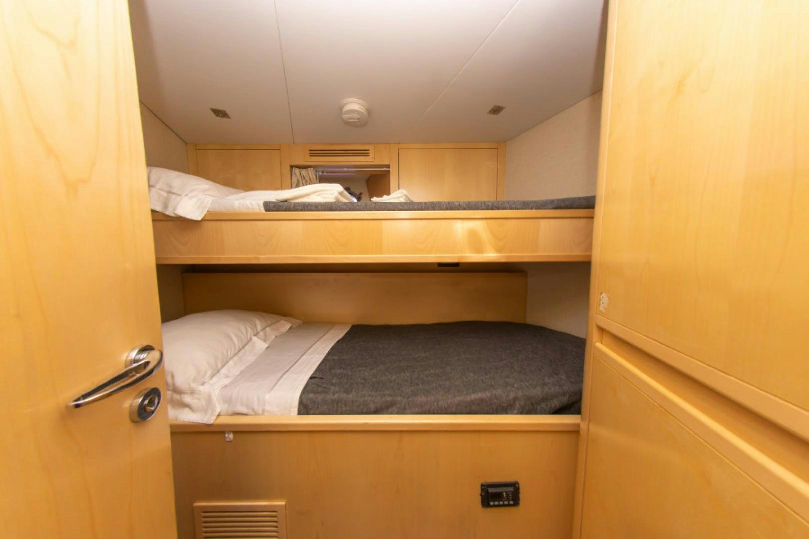 a closet with a bed aboard ADAR Yacht for Sale