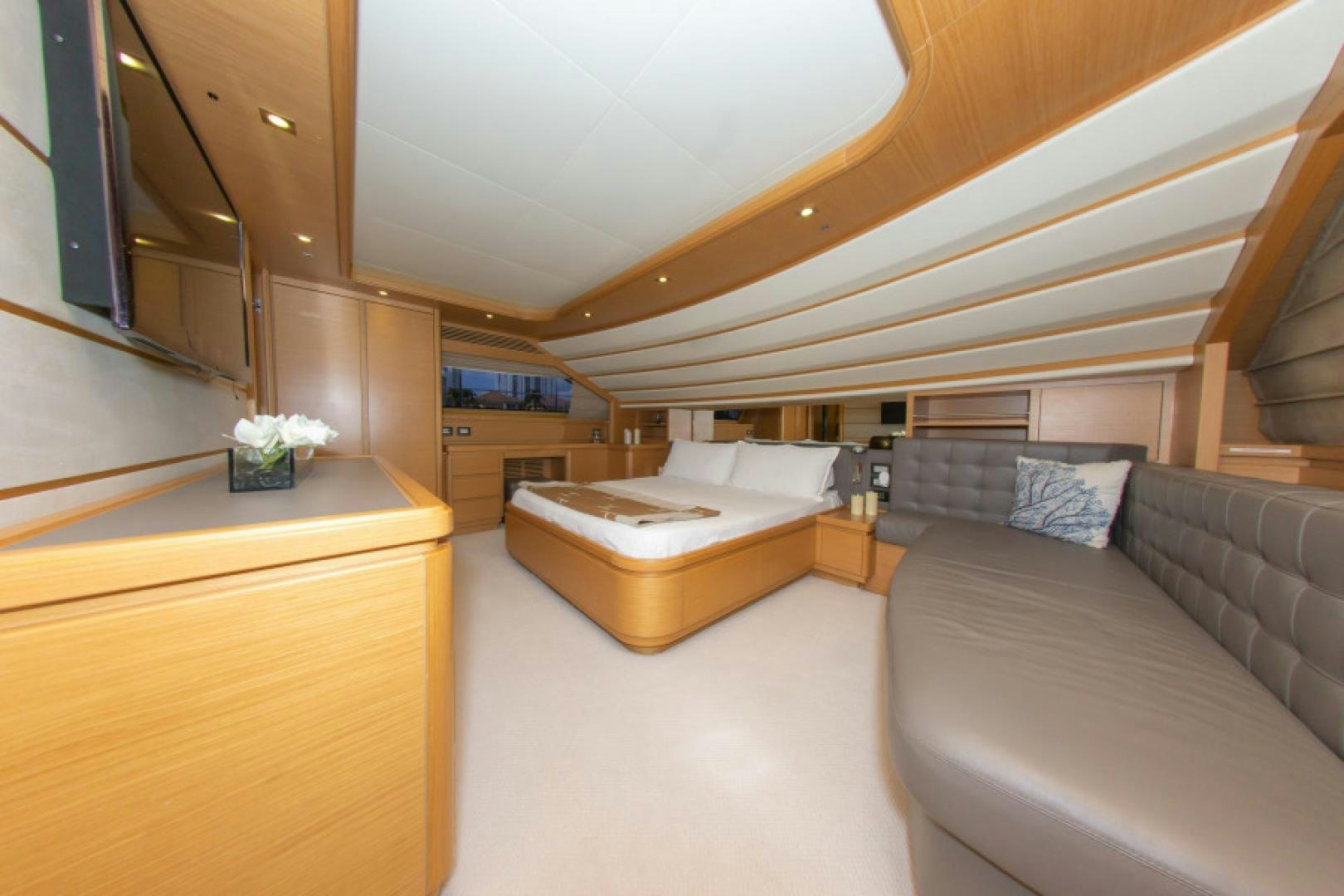 a room with a bed and a couch aboard ADAR Yacht for Sale