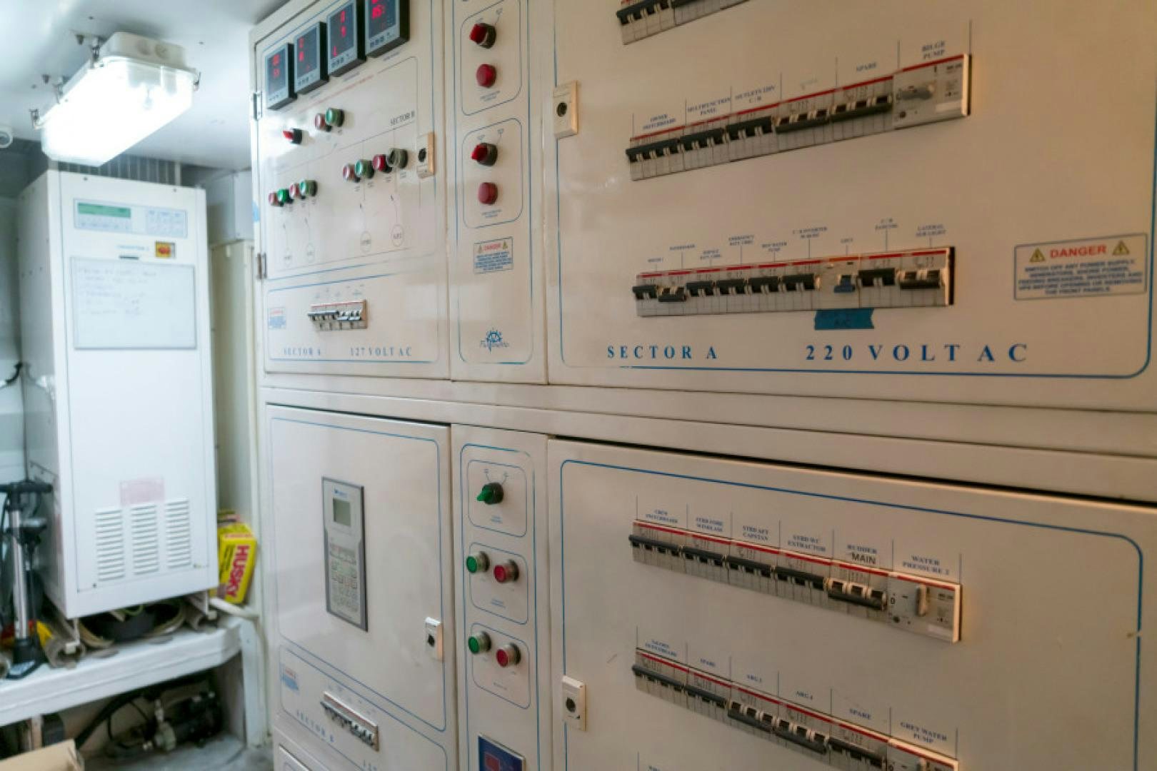 a white machine with red buttons aboard ADAR Yacht for Sale