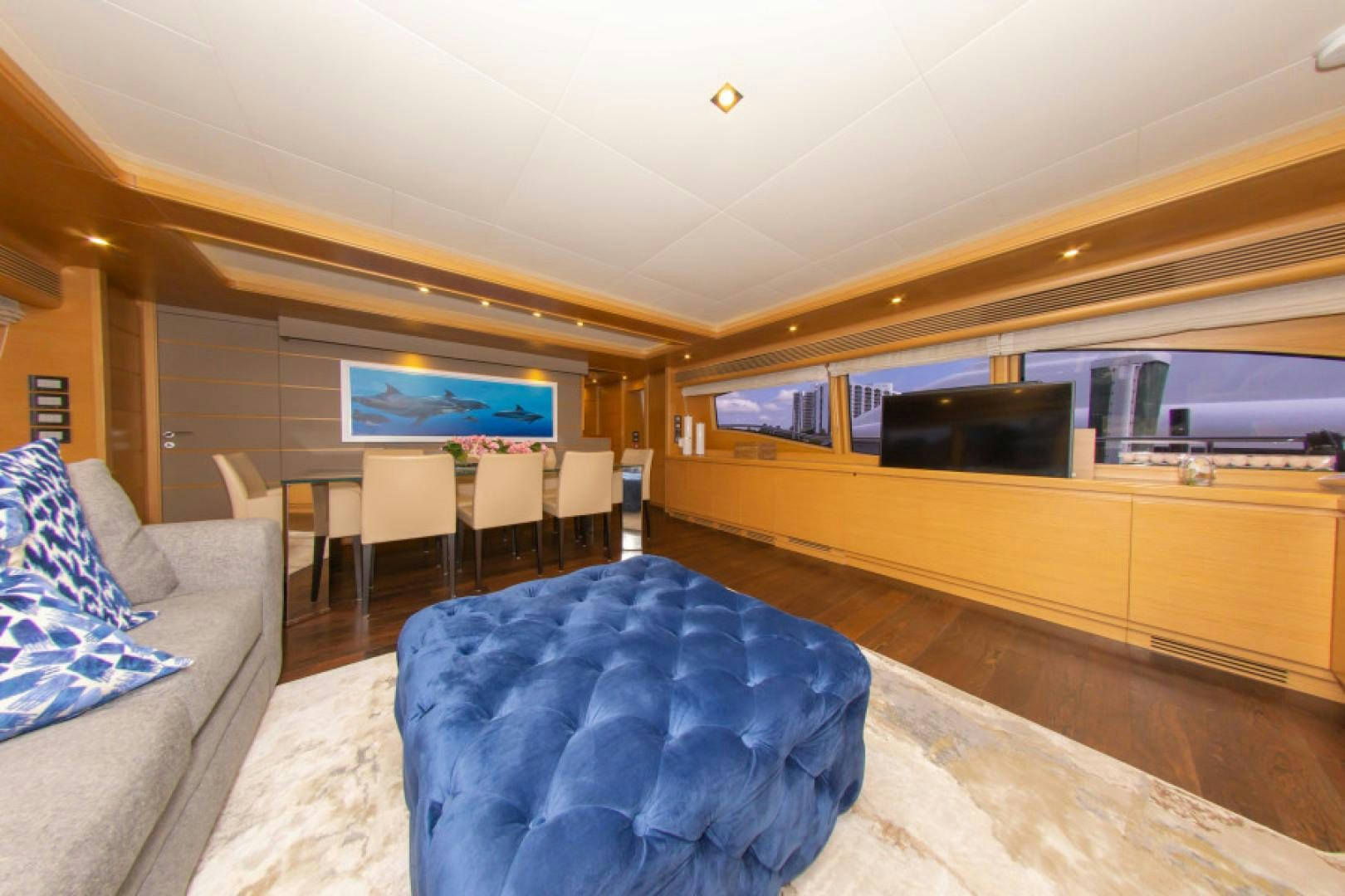 a room with a couch and a tv aboard ADAR Yacht for Sale