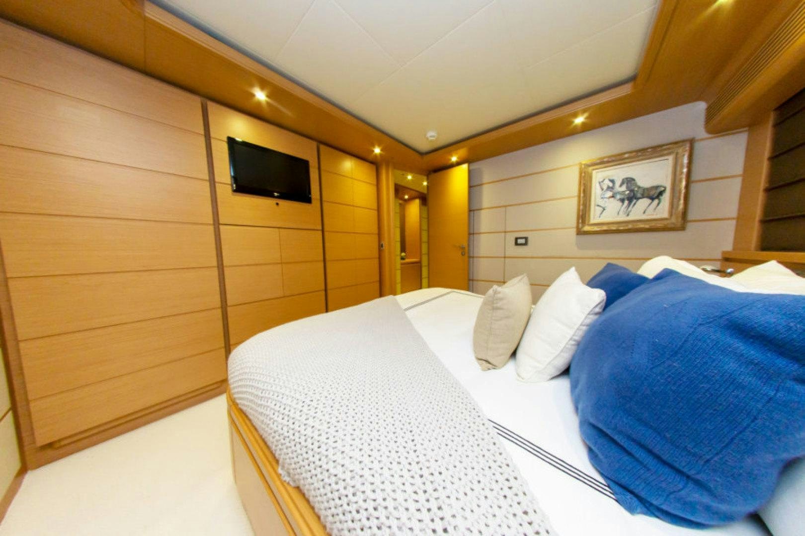 a room with two beds aboard ADAR Yacht for Sale