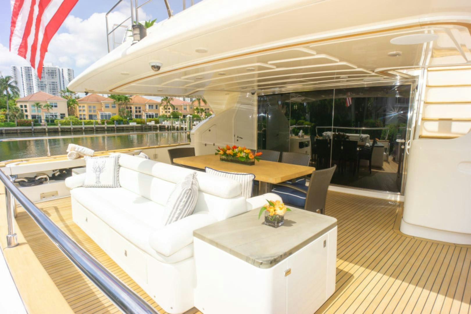 a room with a table and chairs aboard ADAR Yacht for Sale