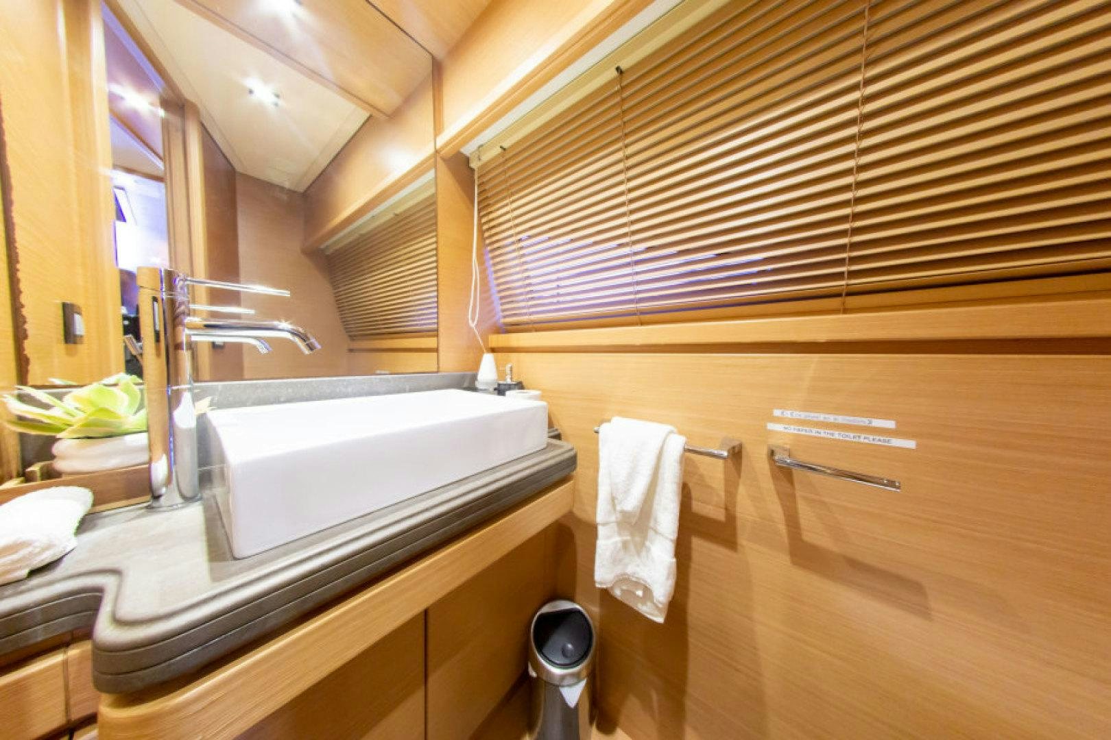 a bathroom with a sink and a mirror aboard ADAR Yacht for Sale