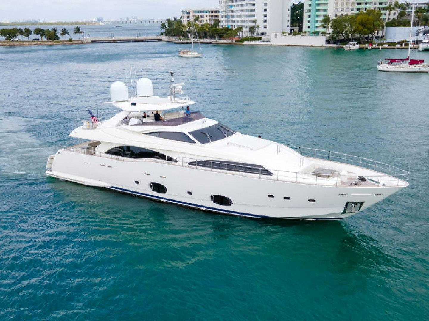 a white yacht in the water aboard ADAR Yacht for Sale