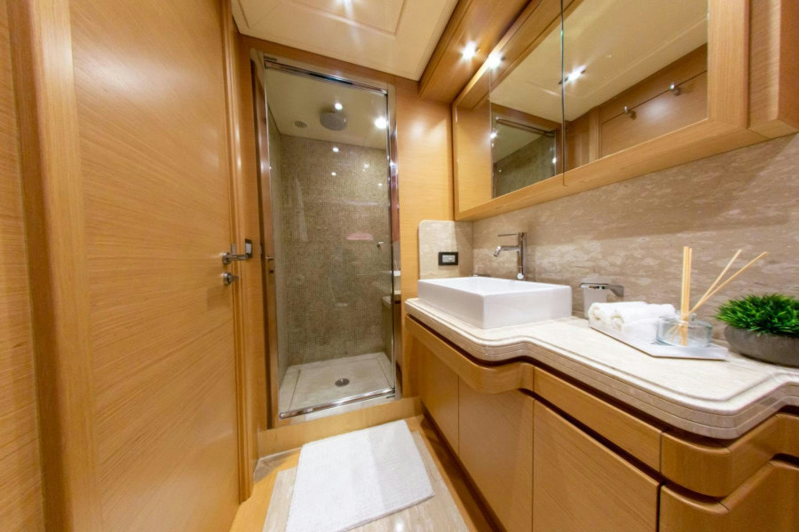 a bathroom with a glass shower aboard ADAR Yacht for Sale