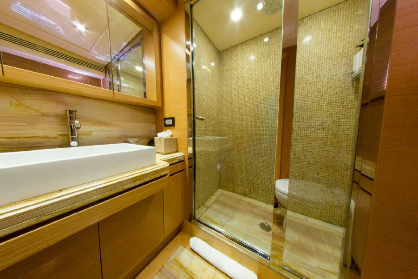 a bathroom with a glass shower aboard ADAR Yacht for Sale