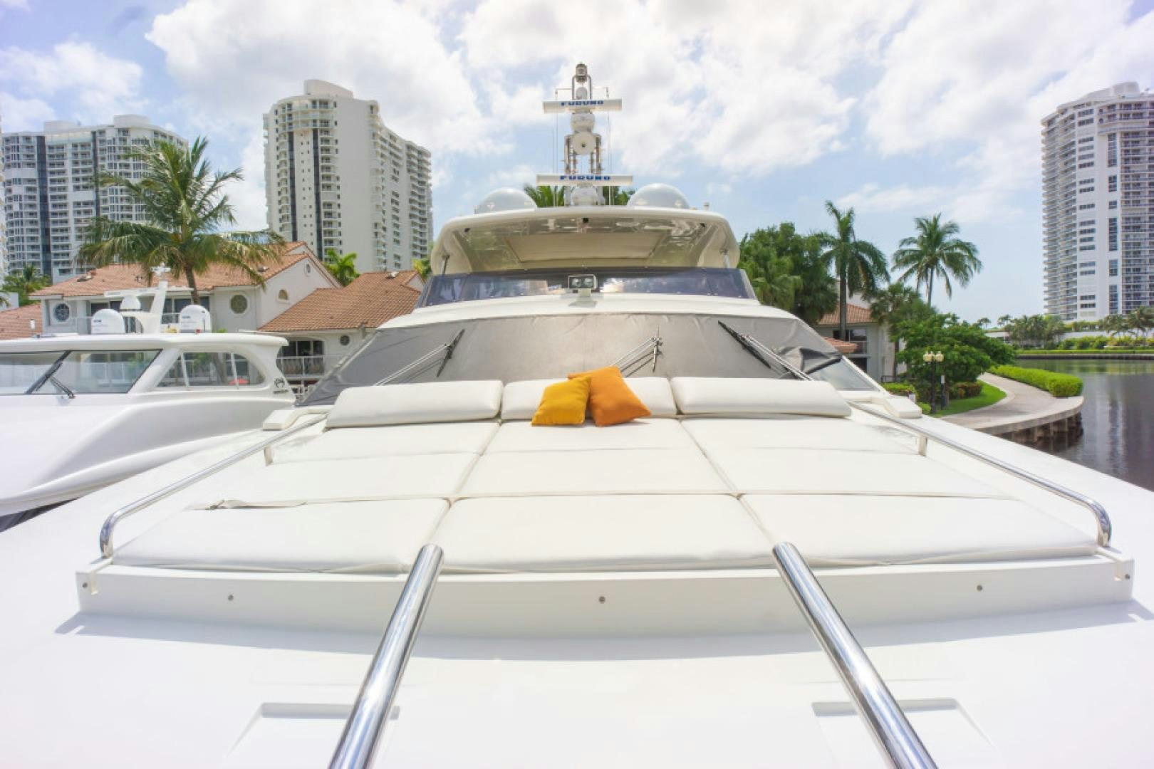 a white yacht with a gold crown aboard ADAR Yacht for Sale